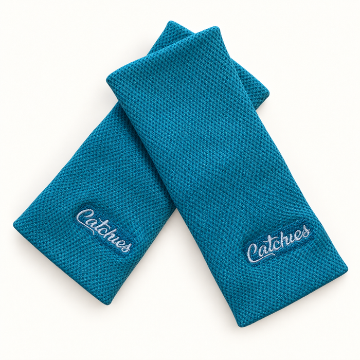Beachy Balance Blue wristbands in crossed arrangement on ivory background