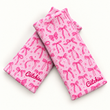 Coquette Catchies knit fabric wristbands with small pink bows