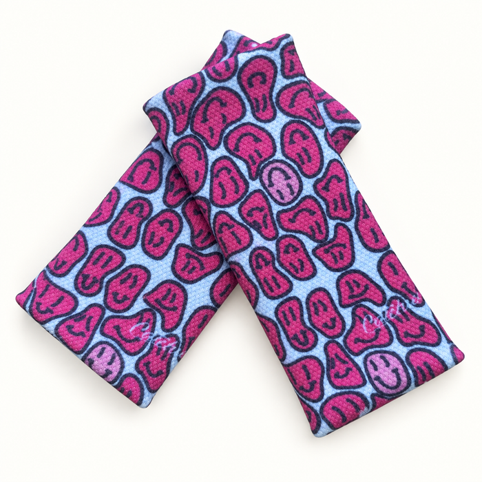 Kip Smiling wristbands in crossed arrangement on ivory background