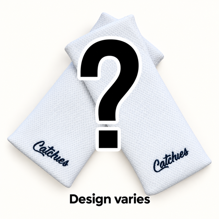 Mystery grab bag Catchies wristbands in crossed arrangement on ivory background