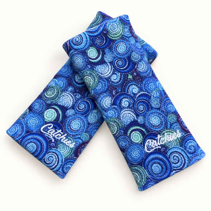 Salto Skies Catchies (Gogh for the Gold) wristbands in crossed arrangement on ivory background