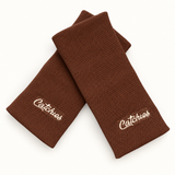 Mocha wristbands in crossed arrangement on ivory background