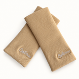 Latte wristbands in crossed arrangement on ivory background