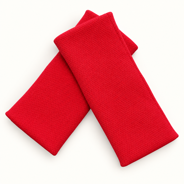 Sleigh Red Catchies wristbands in crossed arrangement on ivory background