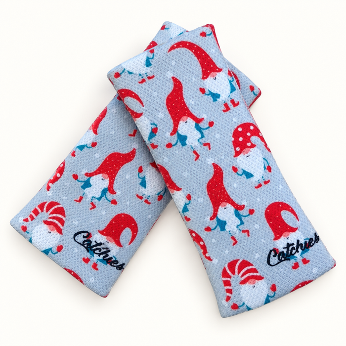 Snow Gnomes — Limited Edition wristbands in crossed arrangement on ivory background