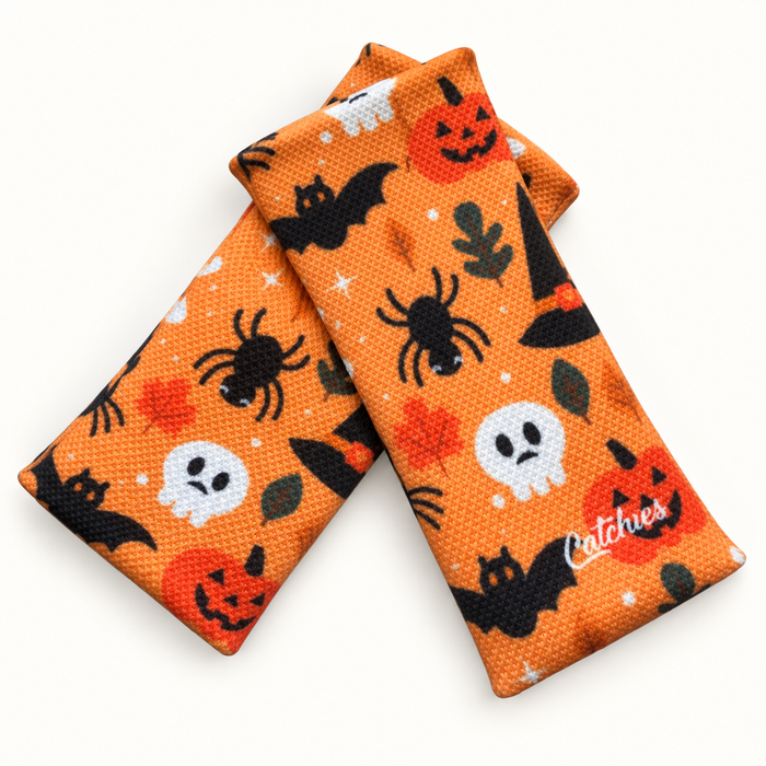Spook-y-licious Catchies Bands wristbands in crossed arrangement on ivory background