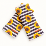 Sunflower Vibes Catchies wristbands in crossed arrangement on ivory background