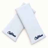 white Catchies wristbands crossed on ivory background